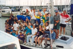 053-Thursday-Rum-Race-participants-gather-on-one-of-the-Stewarts-for-a-post-race-tot-of-rum-Stewart-Association-Collection